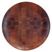 A circular wooden Elite Global Solutions melamine plate with a checkered pattern.