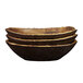 A stack of three Elite Global Solutions rectangular melamine serving bowls with brown wood grain on top.