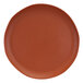 A close-up of an Elite Global Solutions Morocco round speckled matte sunburn terra cotta plate.