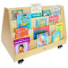 A wooden book rack with many books on wheels.