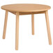 A Whitney Brothers round wooden children's table with legs.