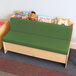 A green cushioned Whitney Brothers Comfy Reading Center with books on top.