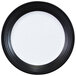 An Elite Global Solutions round black and white melamine plate with a rim.