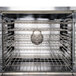 A stainless steel Garland convection oven with racks inside.