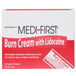 A red and white box of Medique Medi-First burn cream packets.