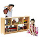 A Whitney Brothers toddler-height storage cabinet with toys inside and a boy and girl playing.