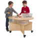 Two boys playing with Whitney Brothers collaboration table with trays.