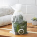 A bag of Noble Eco Novo Terra hotel toiletries and a towel.