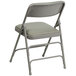 A Flash Furniture gray metal folding chair with a padded seat.