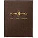 A brown Menu Solutions Water Street wicker menu cover with gold text on white paper.