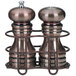 A Chef Specialties burnished copper salt and pepper shaker set in a metal holder.