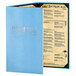 A blue Menu Solutions Slim Line customizable menu cover with black text on a table.
