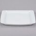 A white rectangular Arcoroc tray with a small rim.