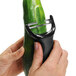 A person using an OXO "Y" vegetable peeler to peel a cucumber.