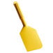 A yellow plastic Carlisle paddle with a black top.