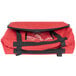 A red Sterno SpeedHeat insulated food pan carrier bag with black straps and a zipper.