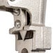 The metal clamp and screw tool of an Edlund #2 Manual Can Opener.