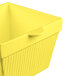 A yellow cast aluminum square condiment bowl with a handle.
