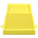 A yellow cast aluminum square bowl with a white background.