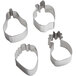 A group of Ateco stainless steel fruit-shaped cookie cutters on a white surface.