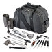 A grey duffel bag with black straps containing a variety of silver Barfly bartending tools.