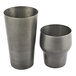 Two metal cups with a vintage grey finish.