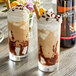Two glasses of ice cream with DaVinci Gourmet Classic Tiramisu syrup and chocolate toppings.