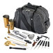 A grey Barfly bag with black straps containing gold-plated bartending tools.