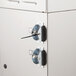 The metal lock on a Bunn airpot brewer cabinet.
