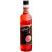 A close up of a bottle of DaVinci Gourmet Classic Guava Flavoring syrup with red liquid inside.