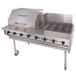 A large stainless steel Bakers Pride outdoor charbroiler with dual purpose wind and splash guard.