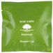 A green plastic bag with white text that reads "Basic Earth Botanicals Hotel and Motel Shower Cap" containing a green and white shower cap.