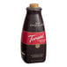 A close up of a Torani Puremade Dark Chocolate Flavoring Sauce bottle.