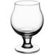 An Acopa clear Belgian beer tasting glass with a stem on a white background.