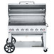 A Crown Verity liquid propane outdoor grill with wheels and a lid open.
