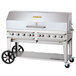 A large stainless steel Crown Verity outdoor grill with wheels and a stainless steel top.