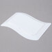 A white rectangular Fineline plastic salad plate with a curved edge.