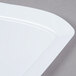A white Fineline rectangular plastic salad plate with a wavy edge.