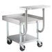 A Regency stainless steel equipment stand with a shelf and casters.