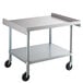 A Regency stainless steel equipment stand with wheels.