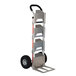 A silver Magliner hand truck with pneumatic wheels and a black U-loop handle.