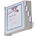 A Durable SHERPA wall-mount reference system with gray borders holding file folders.