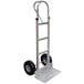 A silver metal Magliner hand truck with black wheels and a vertical loop handle.