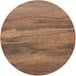 A BFM Seating Relic Knotty Pine round table top with a brown wood finish and cracks.