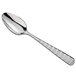 A silver 18/10 stainless steel teaspoon with a white handle.