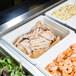A row of Cambro white polycarbonate food pans filled with shrimp, chicken, and salad on a counter.