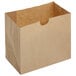 A brown paper bag with a curved edge and a hole in the middle.