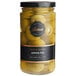 A jar of Belosa Lemon Peel Stuffed Queen Olives with a yellow label on a yellow and white surface.