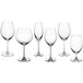 A group of clear Acopa Elevation wine glasses with stems.