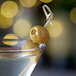 A martini with Belosa Blue Cheese & Jalapeno Pepper Stuffed Queen Olives on a stick.